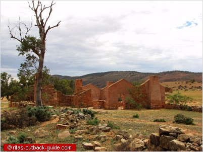 Ruins in front of a mountain range