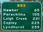 road sign with travel distances