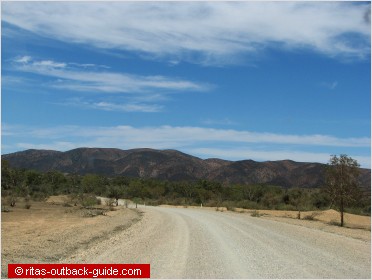 gravel road and mountain range