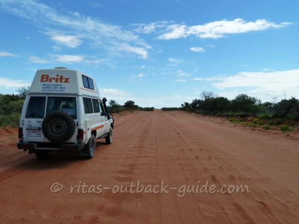 A rough road in the Outback, and a 4WD camper.
