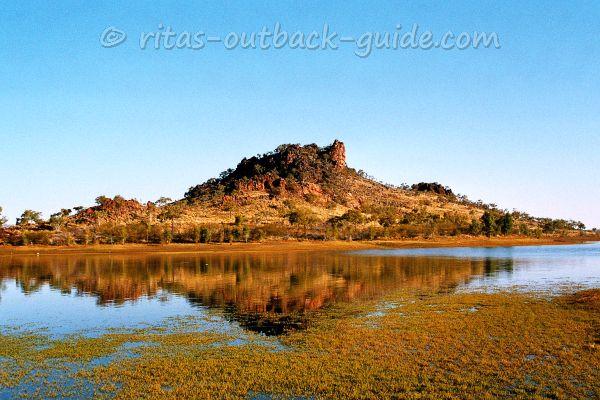 Colourful hill is mirroring in the water of Chinaman Creek Dam Colourful hill is mirroring in the water of Chinaman Creek Dam