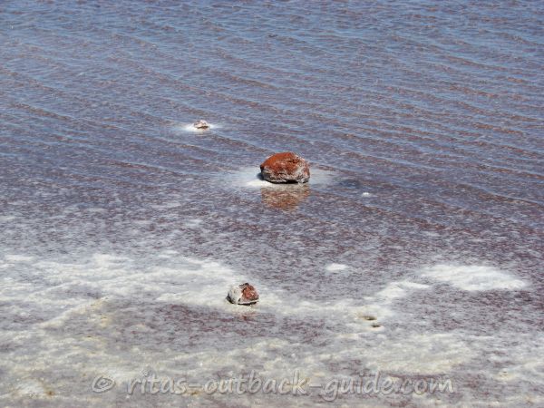 red rocks in a shallow lake