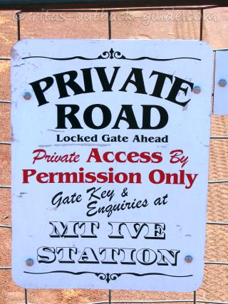 sign at a station gate saying private road