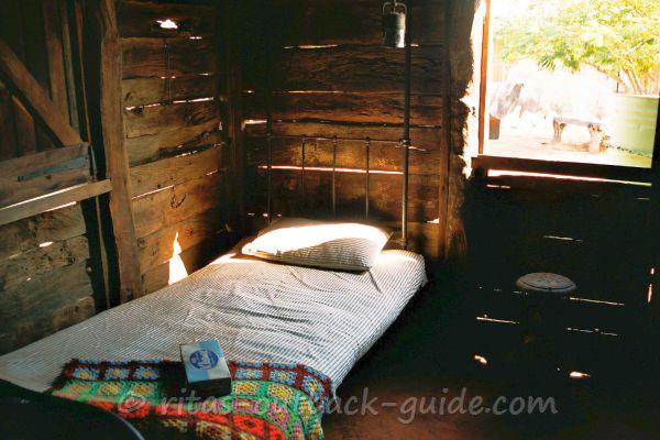 A basic bed in a wooden shed - accommodation in the Outback is much better these days