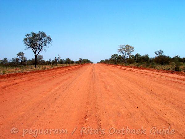 Red dirt road in Outback Queensland Red dirt road in Outback Queensland
